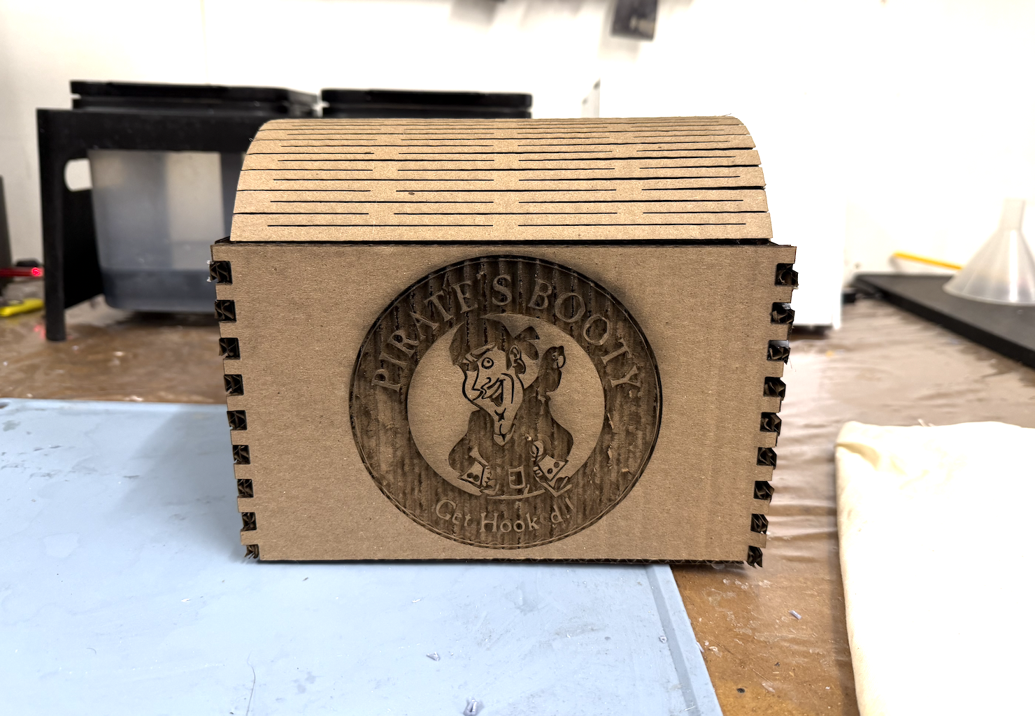 Final treasure chest box with engraved Pirate's Booty logo on the front