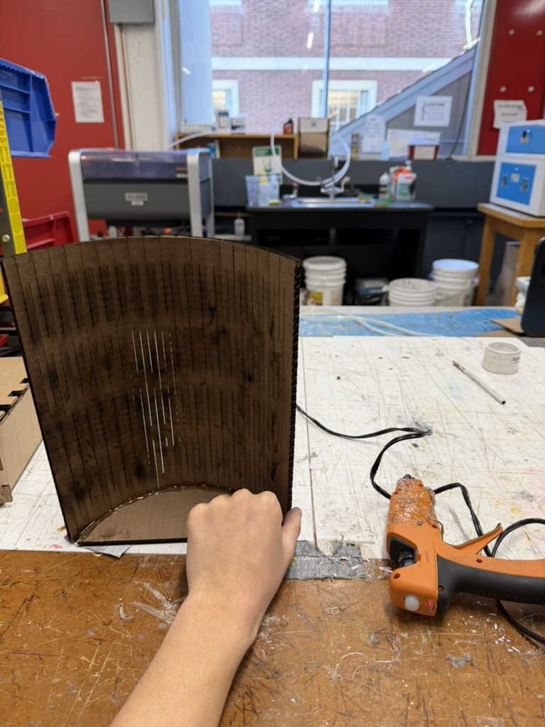 Hot gluing the living hinge lid onto the treasure chest