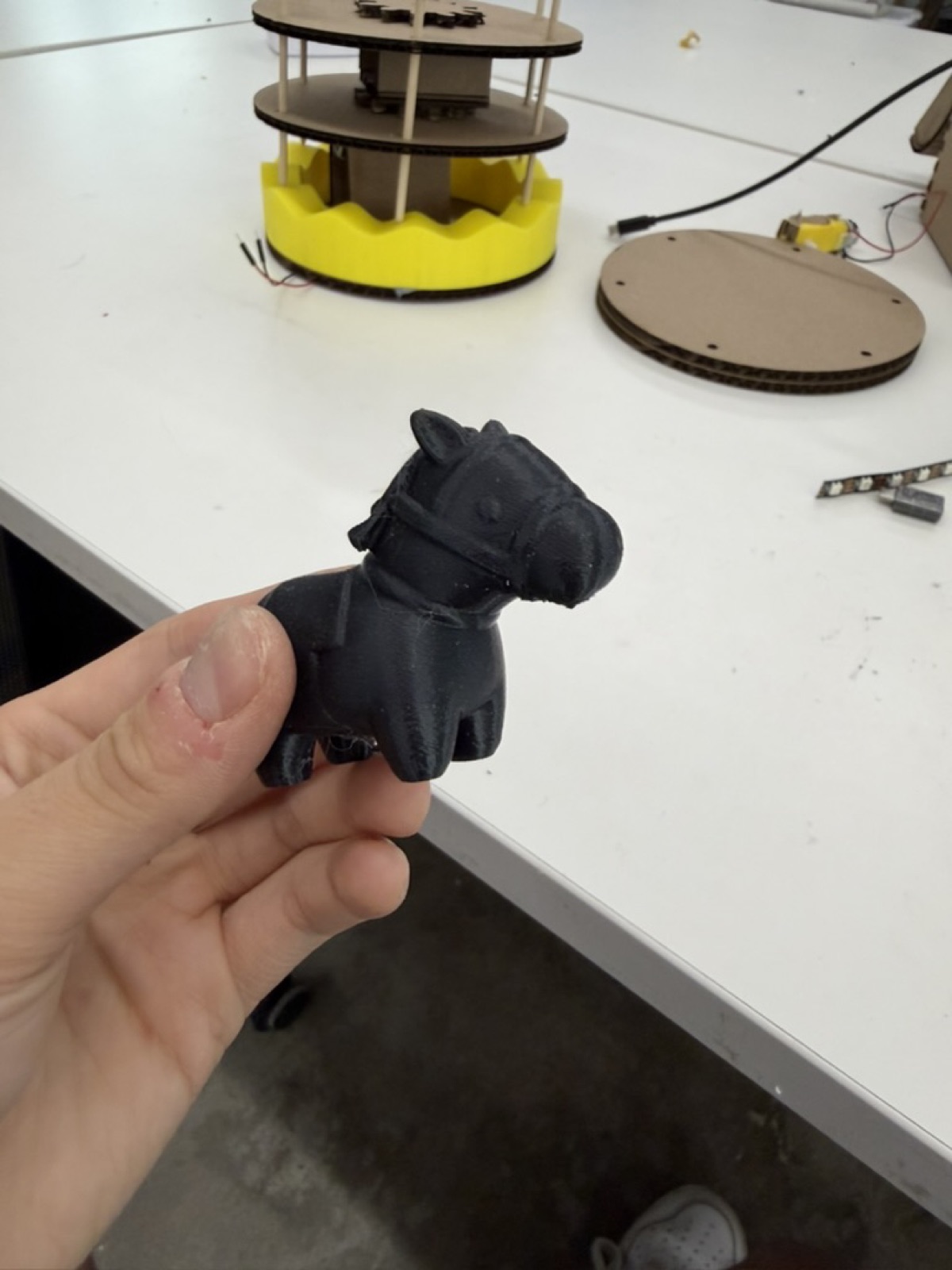 Heavy black 3D printed horse considered for the merry-go-round
