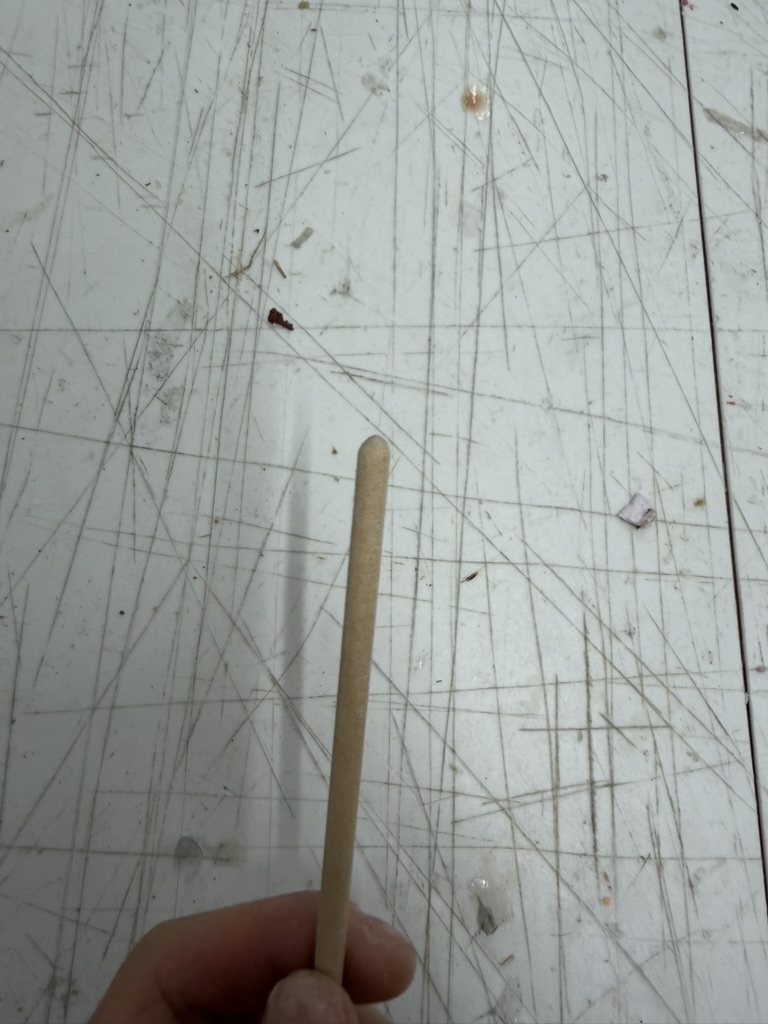 Sanded wooden rod with a rounded bottom edge