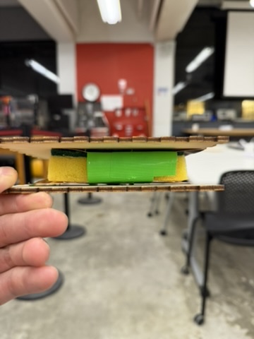 Side view of the assembled sponge capacitive weight sensor between plywood plates