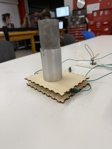Scrap metal pieces placed on the capacitive weight sensor for calibration