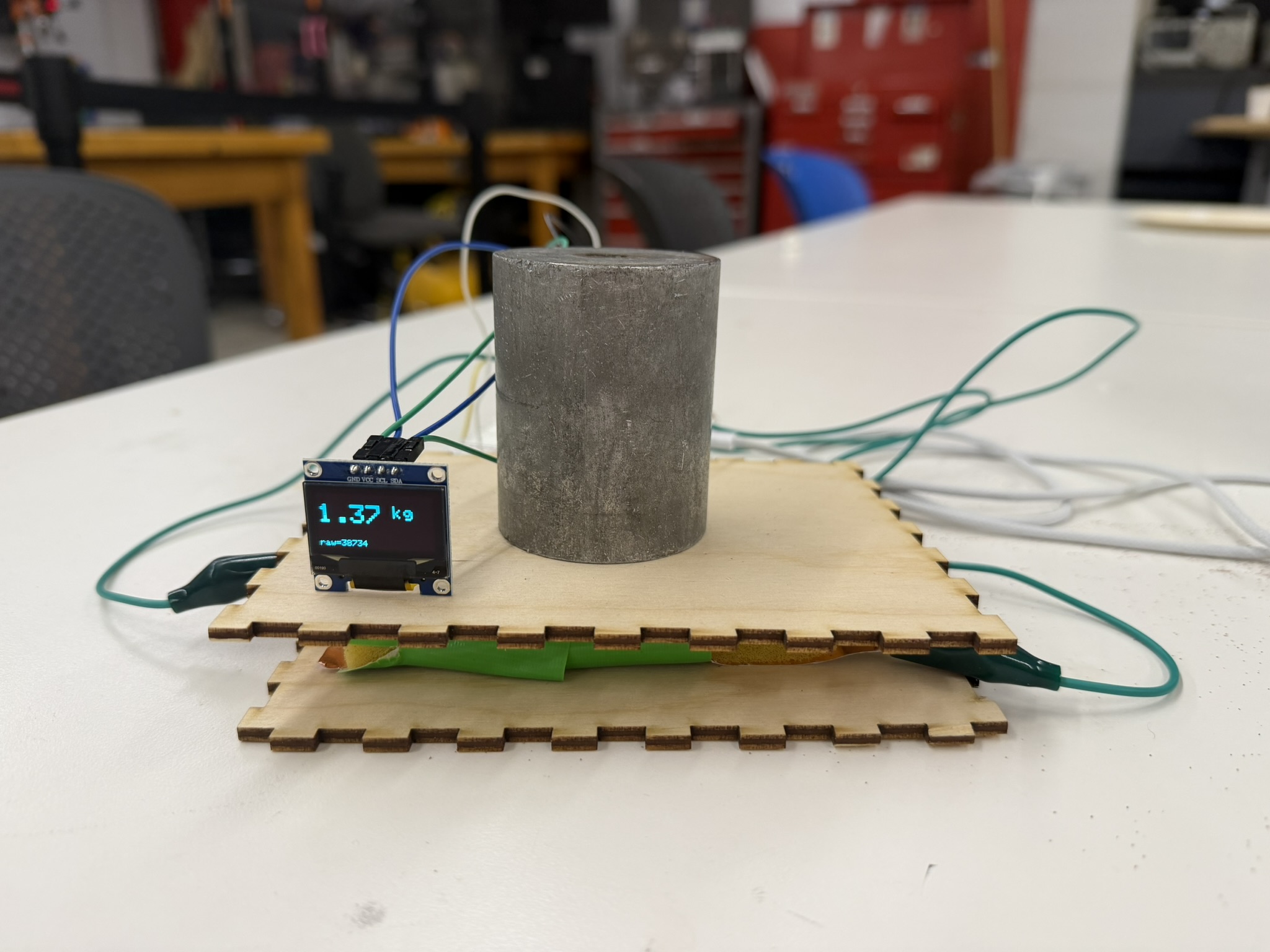Week 6 capacitive weight sensor with OLED display measuring a metal weight