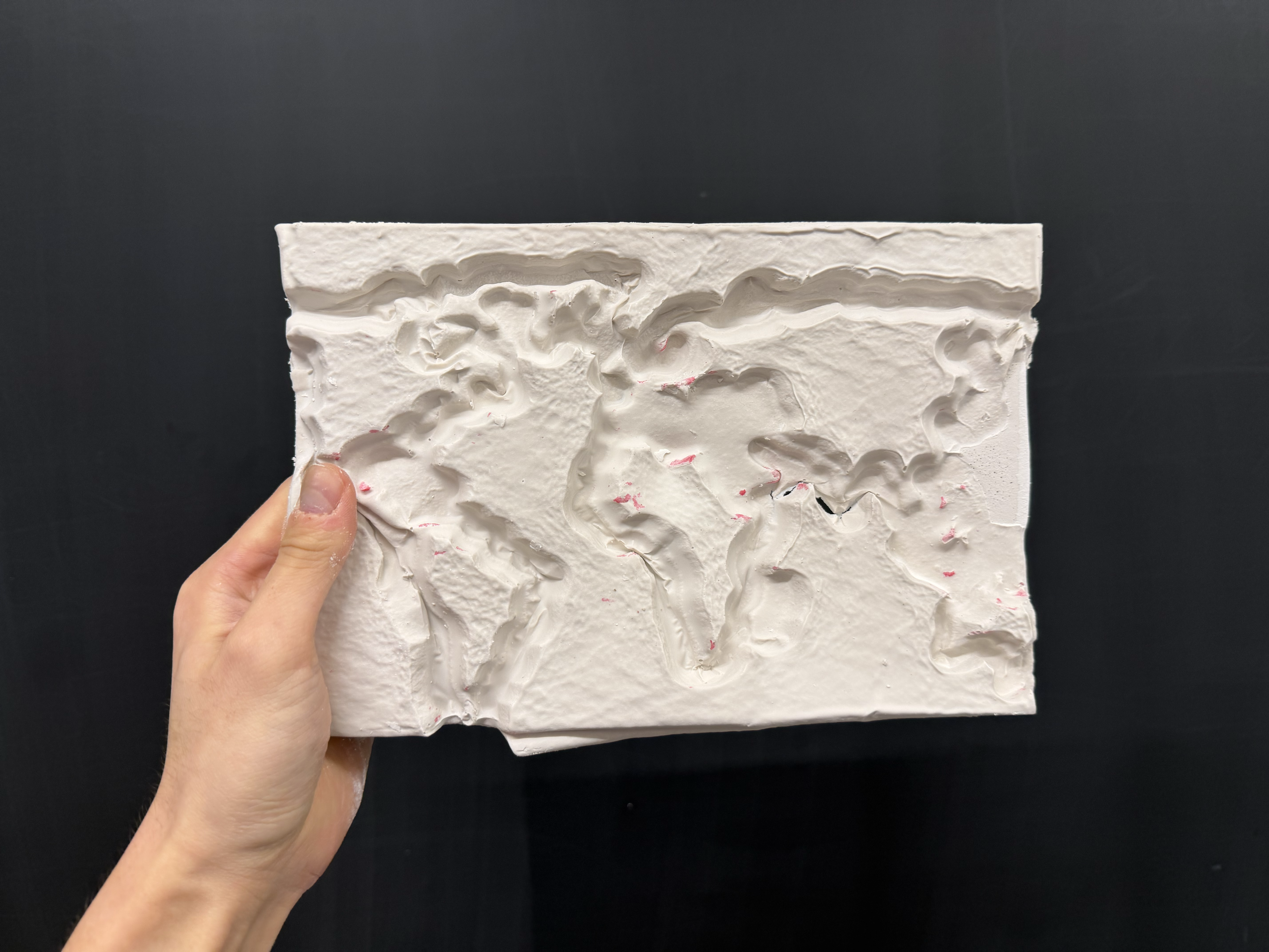 Finished product of the world map in plaster