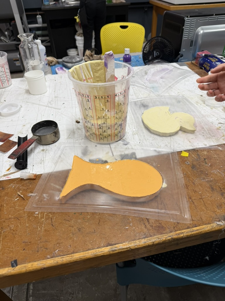 Orange plaster goldfish setting in the clear mold
