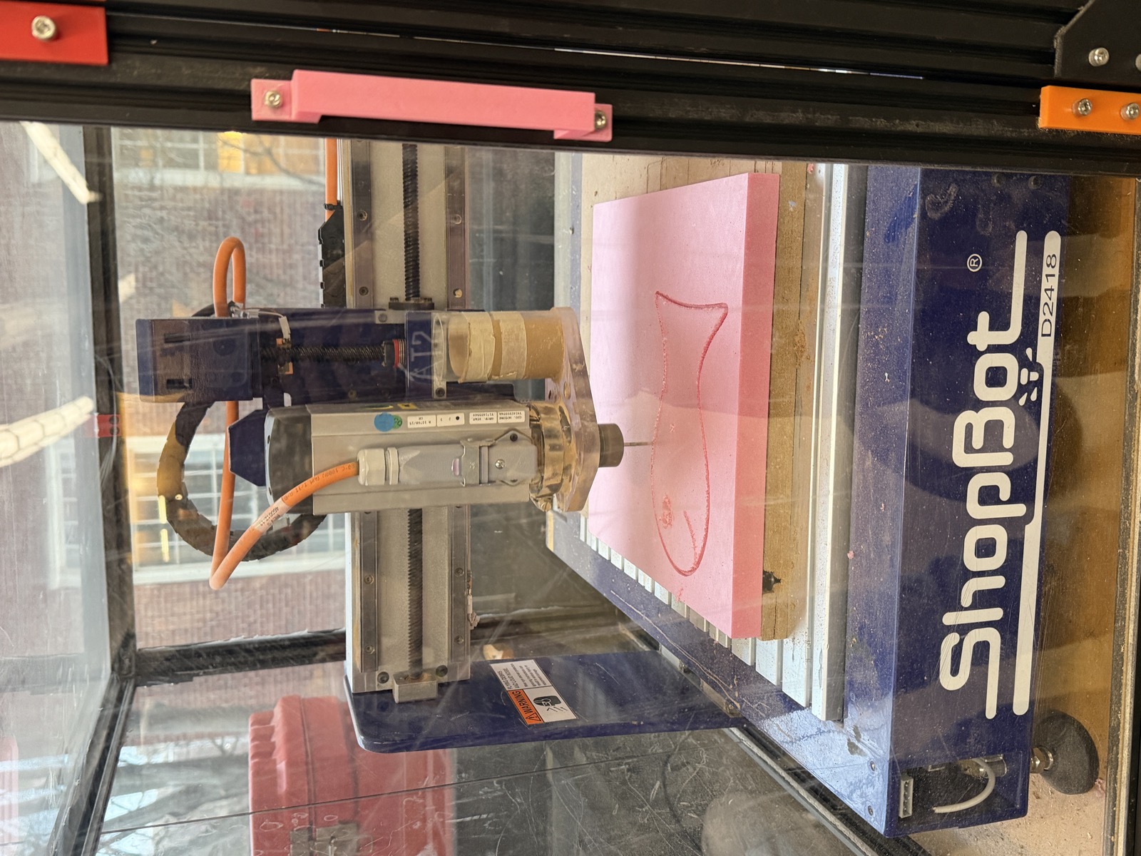 ShopBot cutting the goldfish outline into pink foam