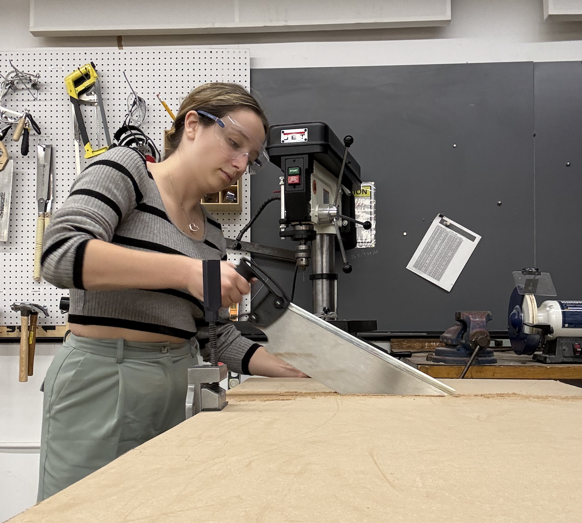 Avery cutting the plywood base