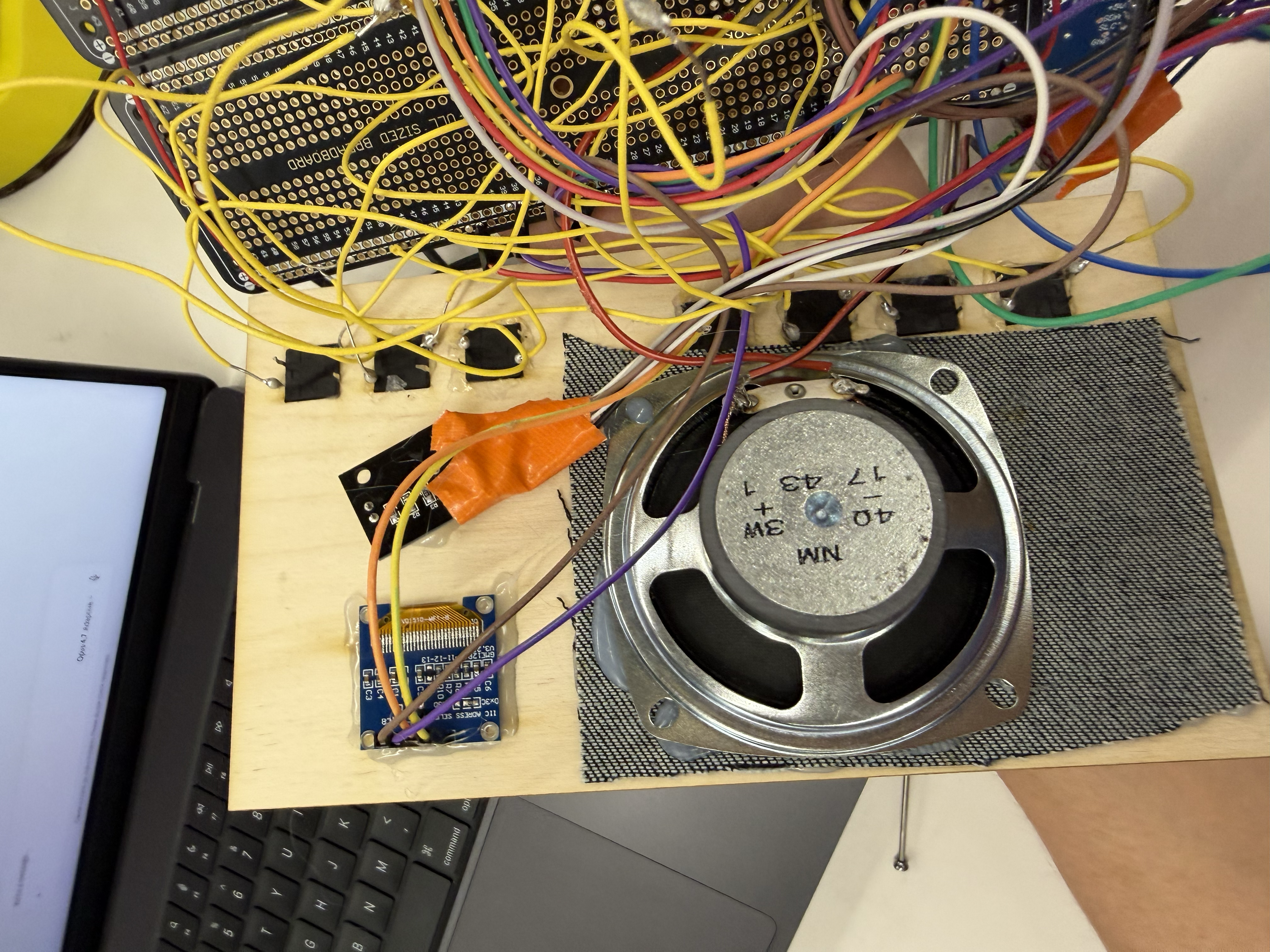 Radio front cover with components secured on top with glue